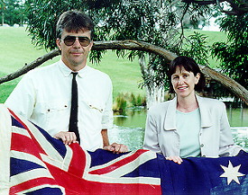 Photo of authors with Australian flag by pond on Campus