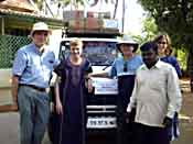 Canada's Families For Children Earthquake Relief Team photo  2004.12.30 with van of supplies in India - CLICK FOR ENLARGEMENT